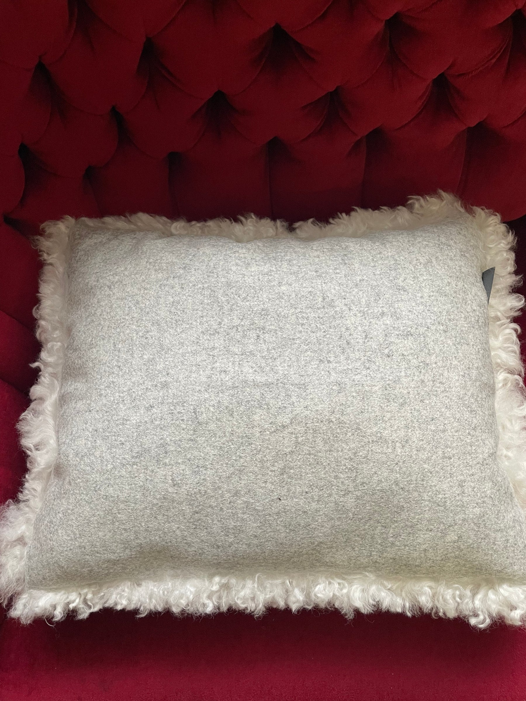 Sheepskin pillow in white silk curls.